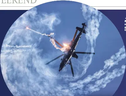  ?? ?? ◀ A Z-10 attack helicopter shoots flares while making a spin in the air. Flares can distract infrared guided missiles that have lock on the chopper.