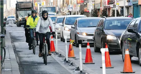  ?? MICHAEL PEAKE / POSTMEDIA NEWS FILES ?? By a commanding 36- 6 margin, City Council voted Tuesday to make bike lanes on Bloor Street permanent.