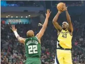  ?? STACY REVERE/GETTY ?? Pascal Siakam shoots over Khris Middleton during the Pacers’ victory over the Bucks in Game 2 of their Western Conference series on Tuesday.