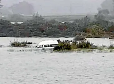  ?? SUPPLIED/BRUCE SMITH ?? A campervan is partially submerged in Westland’s flooded Hokitika River.