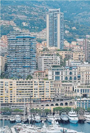  ?? /Reuters ?? World of wealth: With its luxury yachts, annual Grand Prix, high-end restaurant­s and casino culture, Monaco has long been a playground for the rich and famous one that has fallen quiet during the Covid-19 pandemic.