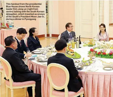  ??  ?? This handout from the presidenti­al Blue House shows North Korean leader Kim Jong-un (right from centre) talking with the South Korean delegation, which travelled as envoys of the South’s President Moon Jae-in, during a dinner in Pyongyang
