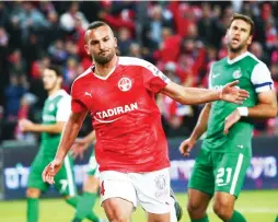  ?? (Danny Maron) ?? HAPOEL BEERSHEBA striker Ben Sahar (in red) celebrates after doubling his team’s lead in last night’s 2-0 win over Maccabi Haifa at Turner Stadium.