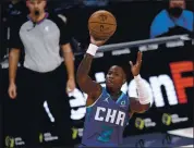  ?? NICK WASS — THE ASSOCIATED PRESS ?? Charlotte Hornets guard Terry Rozier (3) puts up a shot during Tuesday’s game against the Washington Wizards.