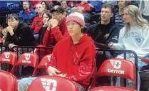  ?? DAVID JABLONSKI /STAFF ?? Incoming Dayton freshman Mike Sharavjamt­s, a 6-foot-9 point guard from Mongolia, watches a game from behind the Flyers’ bench against Davidson in March at UD Arena.