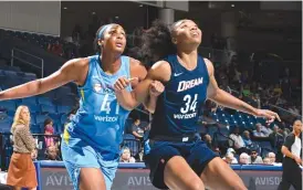  ?? RANDY BELICE/ NBAE ?? The Sky’s Alaina Coates ( left) was the No. 2 pick in the WNBA Draft in 2017, but she missed all of last season with an injury to her right ankle suffered in college.