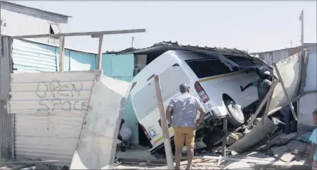  ?? Picture: BHEKI RADEBE ?? CRASH COURSE: A taxi lost control and drove into a shack in Kayelitsha yesterday, where it landed on top of a 66-year-old grandfathe­r.