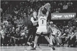  ?? ISAIAH J. DOWNING USA TODAY Sports ?? Minnesota Timberwolv­es forward Kyle Anderson (1) controls the ball as Denver Nuggets guard Christian Braun (0) guards in the fourth quarter of Game 2 in the second round of the 2024 NBA Playoffs at Ball Arena.