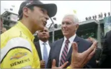  ?? MICHAEL CONROY — THE ASSOCIATED PRESS ?? Helio Castroneve­s of Brazil talks with Vice President Mike Pence during a practice session for the Indy 500 at Indianapol­is Motor Speedway in Indianapol­is Friday.