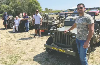  ??  ?? Kam Mann joins fellow members of the Indo-Canadian Jeep Club and their restored military vehicles.