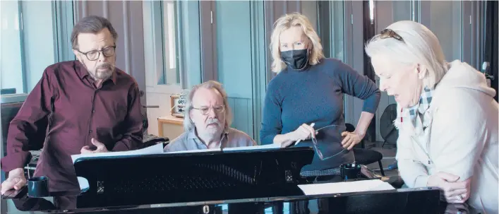  ?? LUDVIG ANDERSSON ?? The members of ABBA — Bjorn Ulvaeus, from left, Benny Andersson, Agnetha Faltskog and Anni-Frid Lyngstad — work in the studio on the pop act’s new album “Voyage.”