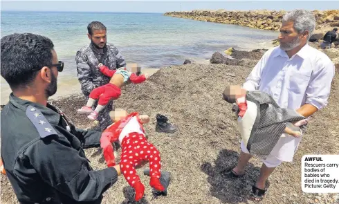  ??  ?? AWFUL Rescuers carry bodies of babies who died in tragedy. Picture: Getty