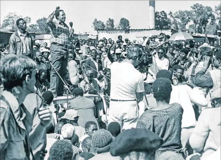  ?? Photo: Gallo Images ?? Inspiratio­nal leader: Chris Hani speaks to a crowd in Katlehong on the East Rand in the early 1990s when the area was wracked with violence between Inkatha Freedom Party and African National Congress supporters.