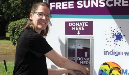  ?? Photo:
Contribute­d ?? TACKLING SKIN CANCER: Laura Conroy from the Toowoomba Hospital Foundation tests out its new sunscreen trailer.