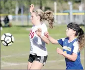  ??  ?? Nikolas Samuels/The Signal Santa Clarita Christian’s Kalona Marr (00) tries to take control of the ball during a home game against Louisville at Central Park on Wednesday.