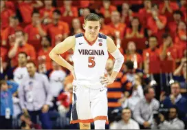  ?? RYAN M. KELLY / GETTY IMAGES ?? Kyle Guy and his Virginia Cavaliers were stunned by a 61-60 overtime loss to unranked Virginia Tech in a week of upsets of Top 10 college teams.