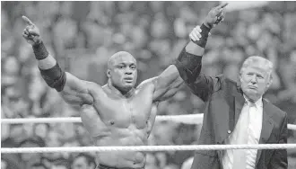  ?? Associated Press ?? Donald Trump, right, shown with Bobby Lashley, is borrowing a page from TV wrestling tactics.