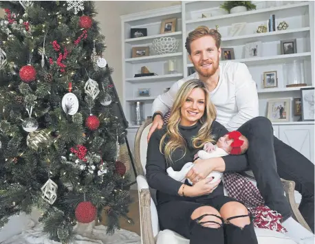  ?? Andy Cross, The Denver Post ?? Avalanche captain Gabe Landeskog and his wife, Melissa, get ready for their first Christmas with their 6-week-old daughter, Linnea. Landeskog’s foot injury allowed him to be home for his daughter’s birth.