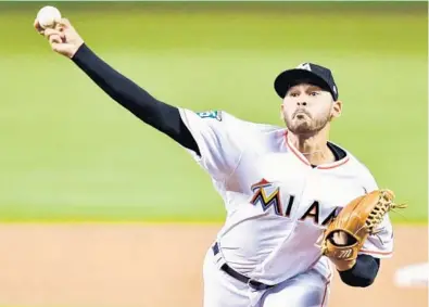  ?? MARK BROWN/GETTY IMAGES ?? Marlins rookie right-hander Pablo Lopez pitches against the Cardinals on Tuesday night. He left in the seventh inning with the game tied, 2-2, and got a no-decision.