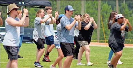  ?? Jeremy stewart ?? Members of the Cedartown High School marching band practice the steps for their 2021 halftime show during band camp in July.