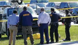  ?? Billy Calzada / Staff photograph­er ?? A man lying on the ground under debris was run over by a Public Works vehicle Thursday at Southeast Military Drive and Goliad. Charges aren’t expected.