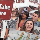  ?? MARK WILSON/GETTY IMAGES ?? People celebrate after the Supreme Court ruled in favor of Obamacare tax credits in 2015.