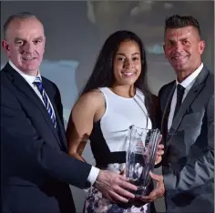  ??  ?? Rianna receiving her award from Tom Dennigan, left, of Continenta­l Tyres and Republic of Ireland manager Colin Bell.