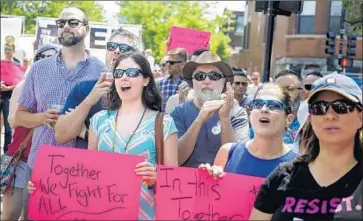  ?? Brian Cassella Associated Press ?? IN THE ANDERSONVI­LLE neighborho­od, people attend an LGBTQ Chicago Equality rally in June.