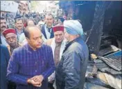  ?? DEEPAK SANSTA/HT ?? Himachal chief minister Jai Ram Thakur takes stock of loss at Lakkar Bazaar in Shimla on Tuesday.