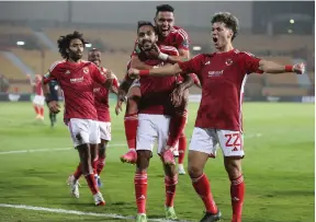  ?? EPA ?? Al Ahly’s players celebrate scoring against Medeama during a CAF Champions League match in Cairo