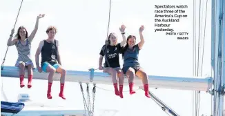  ?? PHOTO / GETTY IMAGES ?? Spectators watch race three of the America’s Cup on the Auckland Harbour yesterday.