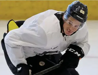  ?? MATT sTonE / hErAld sTAff filE; BElow, BosTon hErAld filE ?? STEPPING UP: Bruins forward Jack Studnicka practices at the Warrior Ice Arena on July 16. Below, Bruins left wing Anders Bjork and Capitals center Evgeny Kuznetsov battle for the puck on Dec. 23, 2019.