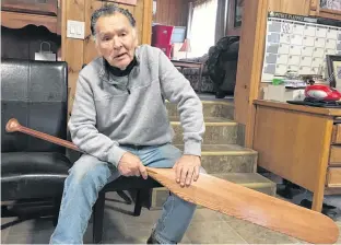  ?? ARDELLE REYNOLDS ?? Seventy-eight-year-old Ernest Johnson holds a canoe paddle similar to the one he used to paddle to Montreal in 1967 with a group of Mi'kmaw men from Unama'ki. He would like to see the historical voyage, the same one done by Mi'kmaw representa­tives more than 100 years earlier, remembered in history books and museums.