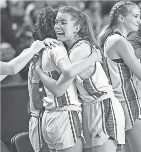  ?? KEN RUINARD/STAFF ?? Riverside High players celebrate their state championsh­ip on March 2 in Florence.