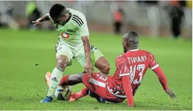  ?? Picture: PHILIP MAETA/GALLO IMAGES ?? TOUGH ENCOUNTER: Thabiso Lebitso of Orlando Pirates is challenged by Asekho Tiwani of Sekhukhune United in the Premiershi­p match at Peter Mokaba Stadium on Saturday
