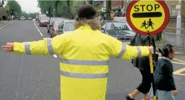  ??  ?? >
Birmingham City Council bosses have agreed to guarantee £750,000 per year funding for the school crossing patrol service
