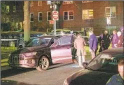  ?? GARDINER ANDERSON/FOR NEW YORK DAILY NEWS ?? Police converged on scene on 72nd Road in Forest Hills Monday night after two men tried to rob, then beat and shot a man in his car.