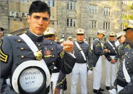  ??  ?? The Associated Press In this May 2016 photo provided by Spenser Rapone, he displays a sign inside his hat after graduating from the United States Military Academy at West Point, N.Y.