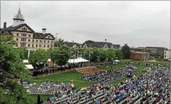  ?? SUBMITTED PHOTO ?? A little bit of rain did not diminish the pride as Widener held commenceme­nt exercises outside despite the elements on Saturday.
