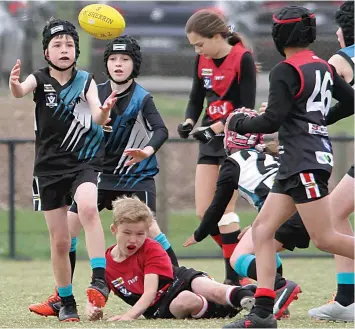  ?? ?? From left: Yarragon’s Saxon Outojic, Yarragon’s Ryan van de Burgt, Warragul’s Isaac Deane (on ground), Warragul’s Alysa Sheehan, Yarragon’s Aster Moles, Warragul’s Musa Wahid and Yarragon’s Arlo Court all compete for the ball.