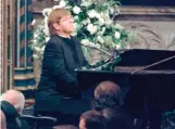  ?? ?? Elton John plays a rewritten version of “Candle in the Wind” during Diana’s funeral at Westminste­r Abbey.