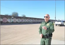  ?? JULIO MORALES FILE PHOTO ?? El Centro sector Assistant Chief david Kim is shown near the outdated and since-replaced internatio­nal barrier in Calexico on feb. 7, 2018.