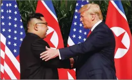  ?? ASSOCIATED PRESS ?? IN THIS JUNE 12, 2018 FILE PHOTO, President Donald Trump shakes hands with North Korea leader Kim Jong Un at the Capella resort on Sentosa Island in Singapore.