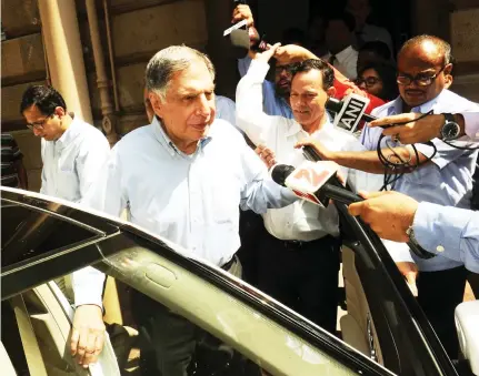  ??  ?? Tata Group’s interim Chairman Ratan Tata leaves Bombay House, the company’s head office, in Mumbai. (AFP)