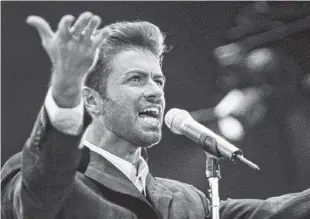  ?? ASSOCIATED PRESS FILE PHOTO ?? George Michael performs at the “Concert of Hope” to mark World AIDS Day at London’s Wembley Arena on Dec. 2, 1993.