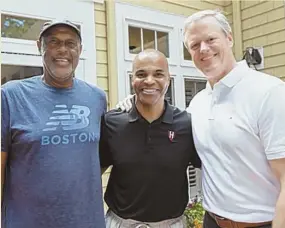  ?? PHOTO BY RUBY WALLAU ?? Former Celtics head coach M.L. Carr, Harvard basketball head coach Tommy Amaker and Crimson alum Gov. Charlie Baker at the annual Tip-Off Cookout for the university’s hoops team.