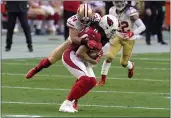  ?? ROSS D. FRANKLIN — THE ASSOCIATED PRESS ?? Arizona Cardinals wide receiver Larry Fitzgerald (11) is tackled by San Francisco 49ers cornerback K’Waun Williams (24) during the first half Saturday in Glendale, Ariz.