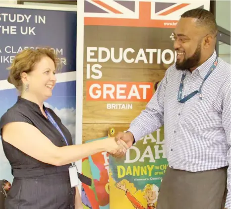  ??  ?? British High Commission­er to Fiji, Melanie Hopkin congratula­tes Dr Mesulame Namedre for being awatrded a scholarshi­p to study at the famous Oxford University in the United Kingdom..