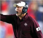  ?? Jonathan Bachman/ Getty Images/TNS ?? ■ Texas A&M Aggies head coach Jimbo Fisher reacts against Ole Miss on Oct. 19, 2019, in Oxford, Mississipp­i. The NCAA announced Thursday that the A&M football program violated NCAA recruiting and countable athletical­ly-related activity rules between January 2018 and February 2019.