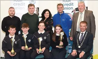  ??  ?? John Long Chairman Chapter 23 Credit Union (seated right) who presented 2nd prize in the Chapter 23 Under 13 Schools Quiz to Gearoid O’Connor, Ian O’Gara, Cian Mason, Holly Sheehy Spa National School, Tralee with (back) Philip Lynch Tralee CU, Tom...